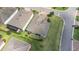 A beautiful aerial view displaying a manicured lawn and the property's proximity to neighboring homes at 3136 Langdon Ln, Winter Haven, FL 33884
