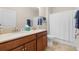 Bathroom featuring double sinks, granite counters, and a shower-tub combination at 3136 Langdon Ln, Winter Haven, FL 33884