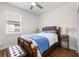 Cozy bedroom featuring a window providing natural light and hardwood floors that add warmth at 3136 Langdon Ln, Winter Haven, FL 33884