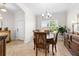 Spacious dining room area showcasing chandelier, wooden furnishings, and neutral decor at 3136 Langdon Ln, Winter Haven, FL 33884