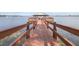 Wooden gazebo on a dock leading out onto a lake at 3136 Langdon Ln, Winter Haven, FL 33884