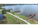 An aerial view of multiple docks on a large, calm lake at 3136 Langdon Ln, Winter Haven, FL 33884