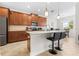 Modern kitchen with granite countertops, stainless steel appliances and a breakfast bar with seating at 3136 Langdon Ln, Winter Haven, FL 33884