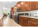 Modern kitchen boasts stainless steel appliances, ample counter space, and stylish cabinetry at 3136 Langdon Ln, Winter Haven, FL 33884