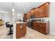 Beautiful kitchen featuring granite countertops, stainless steel appliances, breakfast bar and pendant lighting at 3136 Langdon Ln, Winter Haven, FL 33884