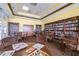 Cozy library with bookshelves and seating for residents' relaxation at 3136 Langdon Ln, Winter Haven, FL 33884