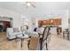 Open-concept living room with tile floors and views into the kitchen, dining room and office at 3136 Langdon Ln, Winter Haven, FL 33884