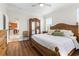 Spacious main bedroom boasts wood floors, a large bed, and plenty of natural light at 3136 Langdon Ln, Winter Haven, FL 33884