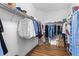 Spacious walk-in closet with ample storage and wood flooring, perfect for organization and convenience at 3136 Langdon Ln, Winter Haven, FL 33884