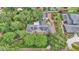 Aerial shot showcasing this property's lush canopy of trees and well-manicured landscaping at 323 E Belvedere St, Lakeland, FL 33803