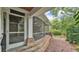 Covered screened-in porch with brick accents provides a charming outdoor living space at 323 E Belvedere St, Lakeland, FL 33803