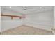 Finished storage room with neutral tile floors, neutral wall paint and a storage shelf at 323 E Belvedere St, Lakeland, FL 33803