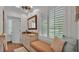 Bathroom featuring a granite countertop, bench seat, and shuttered windows at 323 E Belvedere St, Lakeland, FL 33803