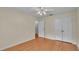 Light-filled bedroom with hardwood floors and a double door closet at 323 E Belvedere St, Lakeland, FL 33803