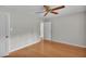 Spacious bedroom with hardwood flooring and a ceiling fan, offering a comfortable living space at 323 E Belvedere St, Lakeland, FL 33803
