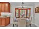 Cozy breakfast nook features a bay window with wood shutters and round table at 323 E Belvedere St, Lakeland, FL 33803