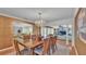 Formal dining room with crystal chandelier and access to the living room at 323 E Belvedere St, Lakeland, FL 33803