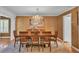 Formal dining room with stylish chandelier and neutral decor at 323 E Belvedere St, Lakeland, FL 33803