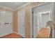 Bright foyer featuring pristine doors, striped wallpaper, and gleaming wood floors at 323 E Belvedere St, Lakeland, FL 33803