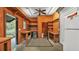 Well-organized garage featuring a utility sink, shelving, work areas, and an adjacent restroom at 323 E Belvedere St, Lakeland, FL 33803