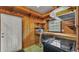 Functional indoor kitchen features wood cabinets, an electric range, and ample lighting at 323 E Belvedere St, Lakeland, FL 33803