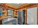 Functional indoor kitchen with natural wood, stainless steel appliances, and ample counter space at 323 E Belvedere St, Lakeland, FL 33803
