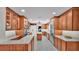Open kitchen showcasing custom cabinetry, stainless steel appliances, and white countertops at 323 E Belvedere St, Lakeland, FL 33803