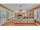 Cozy living room with brick fireplace and plenty of natural light at 323 E Belvedere St, Lakeland, FL 33803