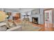 Elegant living room with fireplace and open access to the dining area at 323 E Belvedere St, Lakeland, FL 33803