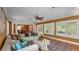 Bright living room featuring a plush sectional sofa, stylish decor, and views to the dining room at 323 E Belvedere St, Lakeland, FL 33803