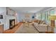 Inviting living room featuring a fireplace, natural light, and neutral tones at 323 E Belvedere St, Lakeland, FL 33803