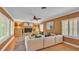 Cozy living room with brick fireplace and comfortable sectional at 323 E Belvedere St, Lakeland, FL 33803