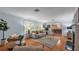 Bright living room with hardwood floors and classic shutters at 323 E Belvedere St, Lakeland, FL 33803
