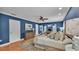 Spacious main bedroom with hardwood floors, fireplace and double doors to other rooms at 323 E Belvedere St, Lakeland, FL 33803