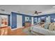 Bright main bedroom with a sitting area, fireplace and doors to other rooms at 323 E Belvedere St, Lakeland, FL 33803