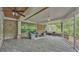 Charming screened-in patio with tile flooring and cozy seating, offering a relaxing outdoor living space at 323 E Belvedere St, Lakeland, FL 33803