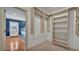 Open walk-in closet with plenty of shelves and hanging storage space at 323 E Belvedere St, Lakeland, FL 33803