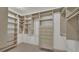 Spacious walk-in closet with custom shelving, drawers, and plenty of storage at 323 E Belvedere St, Lakeland, FL 33803