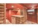 Climate-controlled wine cellar with wooden racks, providing the ideal storage for wine enthusiasts at 323 E Belvedere St, Lakeland, FL 33803