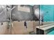 Modern bathroom features an updated shower with black tile and a built-in bench at 3243 Red Tail Hawk Dr, Polk City, FL 33868