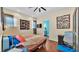 The bedroom has hardwood floors and a ceiling fan at 3243 Red Tail Hawk Dr, Polk City, FL 33868
