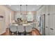 Well-lit kitchen with updated appliances, granite countertops, and a functional kitchen island at 3243 Red Tail Hawk Dr, Polk City, FL 33868