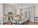 Bright kitchen with stainless appliances, granite counters, and kitchen island at 3243 Red Tail Hawk Dr, Polk City, FL 33868