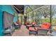 Screened patio with comfortable seating is an inviting outdoor living space at 3243 Red Tail Hawk Dr, Polk City, FL 33868