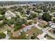 Aerial view of the property with lot line boundaries showing the fenced backyard, shed, and mature trees at 355 E Columbia St, Lake Alfred, FL 33850