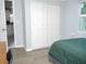 Comfortable bedroom featuring a built-in wardrobe with ample storage at 355 E Columbia St, Lake Alfred, FL 33850