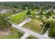 Home with a large lawn and surrounding trees, located near a road in a rural setting at 3810 Harrelson Rd, Lakeland, FL 33810