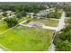 Expansive property with a well-maintained home, large lawn, and surrounding mature trees at 3810 Harrelson Rd, Lakeland, FL 33810