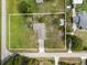 A house sits on a large lot with mature trees in a residential area at 3810 Harrelson Rd, Lakeland, FL 33810