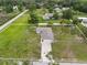 Spacious home with large yard, mature trees, surrounded by other homes and roads at 3810 Harrelson Rd, Lakeland, FL 33810
